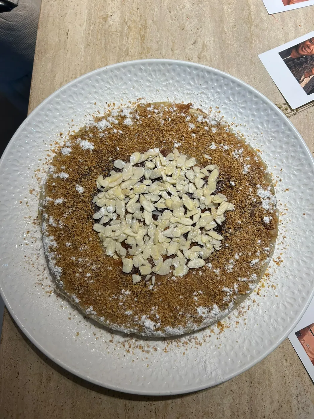 Moroccan dessert finished with toasted almonds and icing sugar