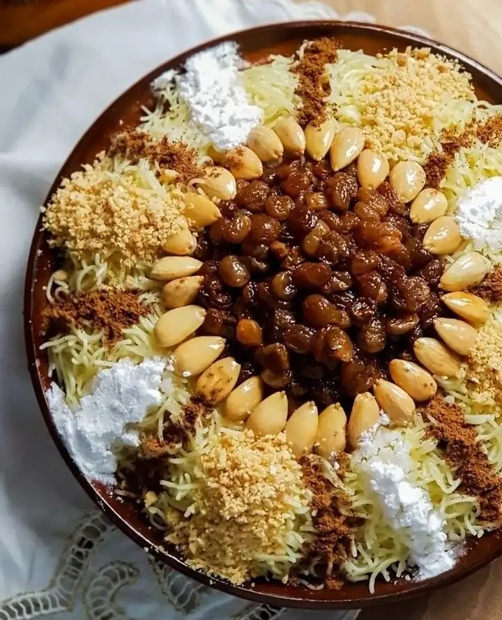 Moroccan seffa topped with almonds, raisins and cinnamon